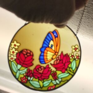 Beautiful butterfly in the Rosegarden round suncatcher